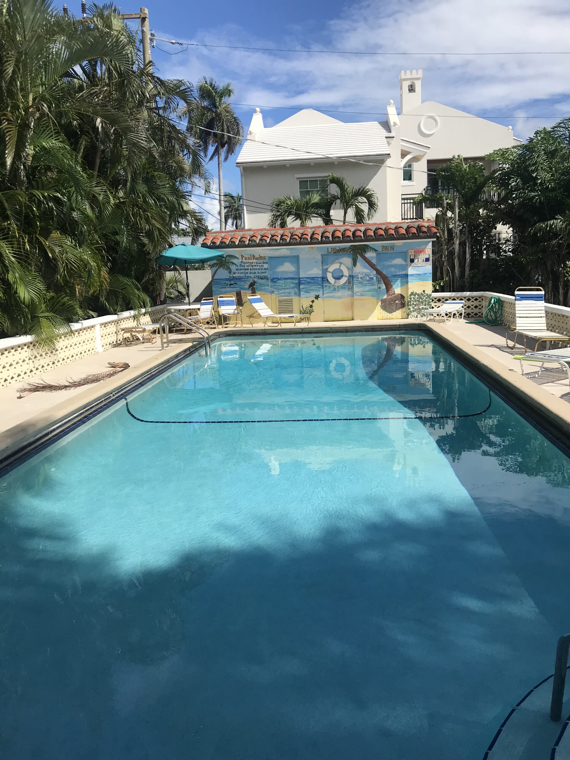 Outdoor heated pool at The Grove Beach Condos in Delray Beach, FL